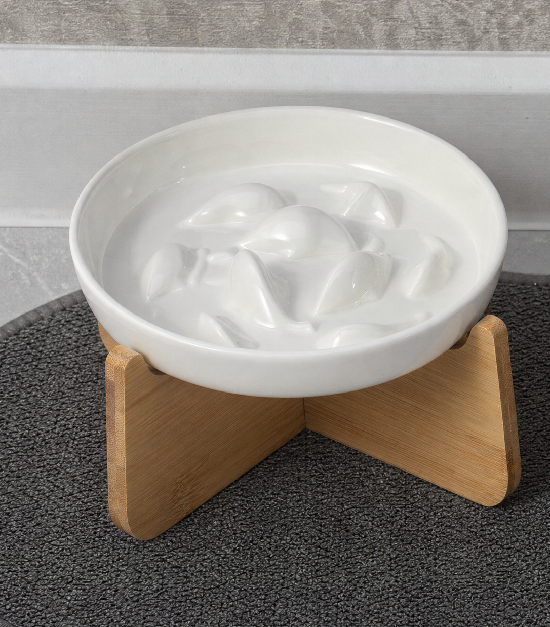 Arlo ceramic bowl lifted out of its wooden stand
