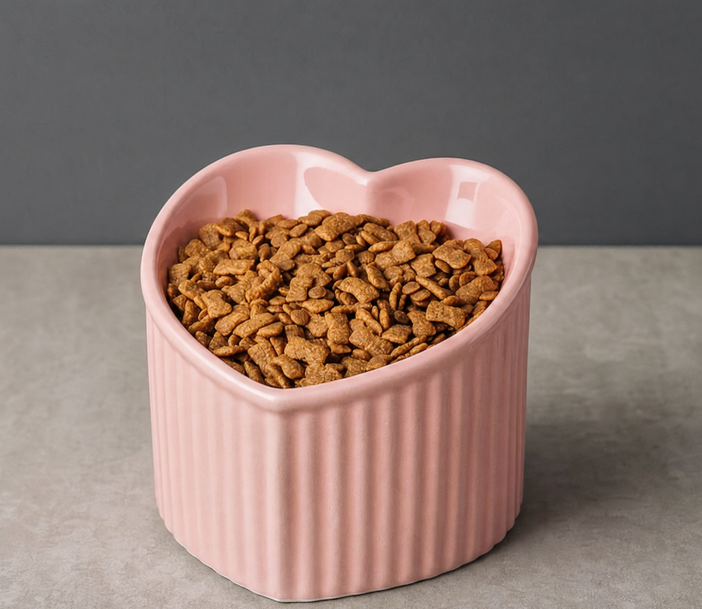 Mira tilted ceramic cat bowl shown in soft green