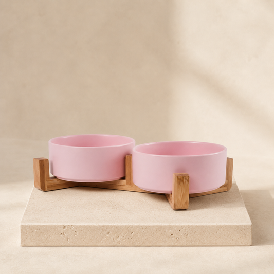 Duo pale pink ceramic double bowl set on a wooden stand