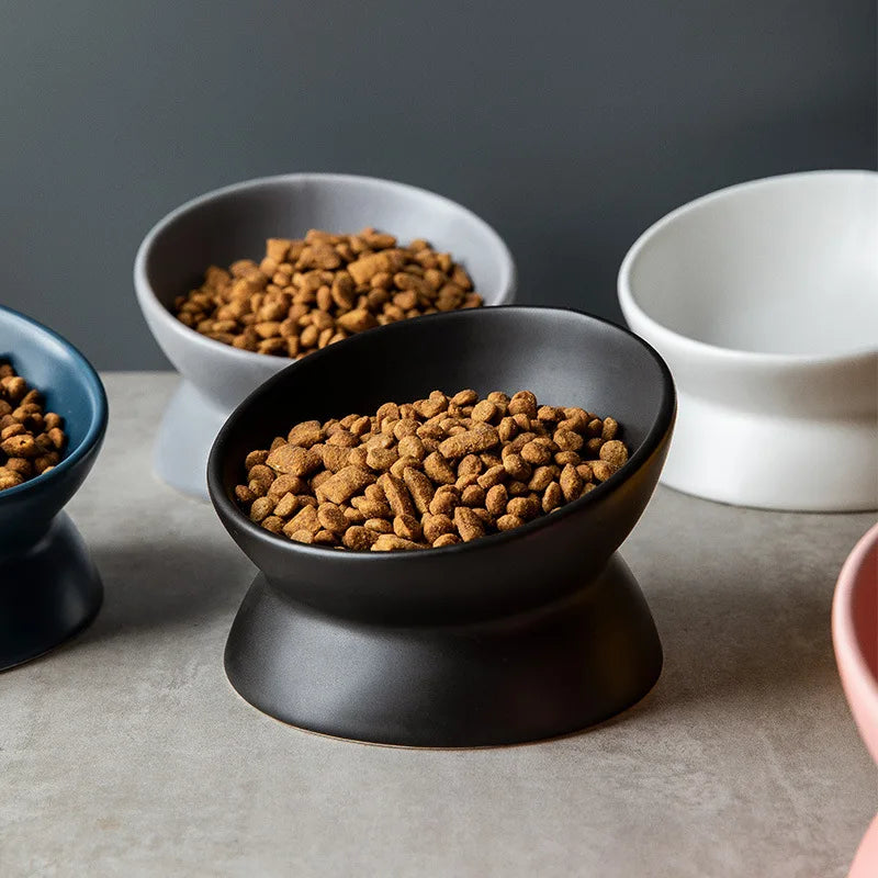 Lumi ceramic pet bowl with a cat eating from it